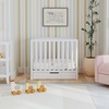 image:imageCarters by DaVinci Colby 4in1 Convertible Mini Crib with Trundle Drawer in White Greenguard Gold Certified Undercrib StorageWhite
