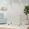 image:imageDavinci Dylan 3in1 Convertible Portable Mini Crib Espresso  GREENGUARD Gold Certified  Folding Baby Crib With Wheels 4 Adjustable Mattress Heights Conversion Kit Sold SeparatelyWhite