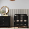 image:imageDavinci Dylan 3in1 Convertible Portable Mini Crib Espresso  GREENGUARD Gold Certified  Folding Baby Crib With Wheels 4 Adjustable Mattress Heights Conversion Kit Sold SeparatelyEbony