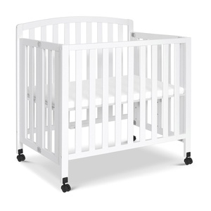 image:imageDavinci Dylan 3in1 Convertible Portable Mini Crib Espresso  GREENGUARD Gold Certified  Folding Baby Crib With Wheels 4 Adjustable Mattress Heights Conversion Kit Sold SeparatelyWhite