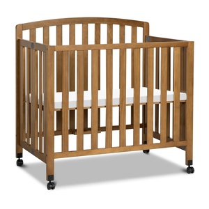image:imageDavinci Dylan 3in1 Convertible Portable Mini Crib Espresso  GREENGUARD Gold Certified  Folding Baby Crib With Wheels 4 Adjustable Mattress Heights Conversion Kit Sold SeparatelyChestnut
