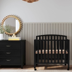 image:imageDavinci Dylan 3in1 Convertible Portable Mini Crib Espresso  GREENGUARD Gold Certified  Folding Baby Crib With Wheels 4 Adjustable Mattress Heights Conversion Kit Sold SeparatelyEbony